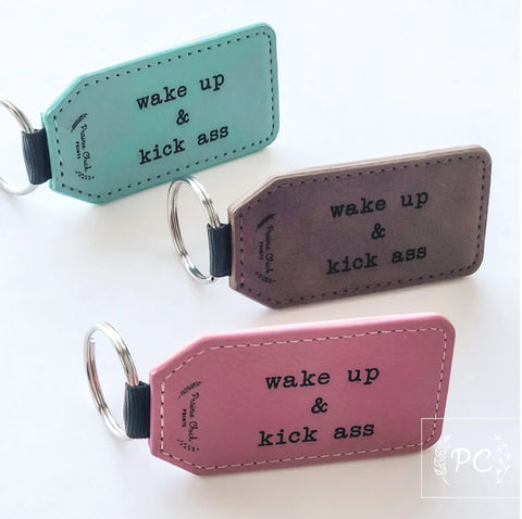 PCP-005 Wake Up Kick Ass Repeat Leather Keychain- (assorted colours)